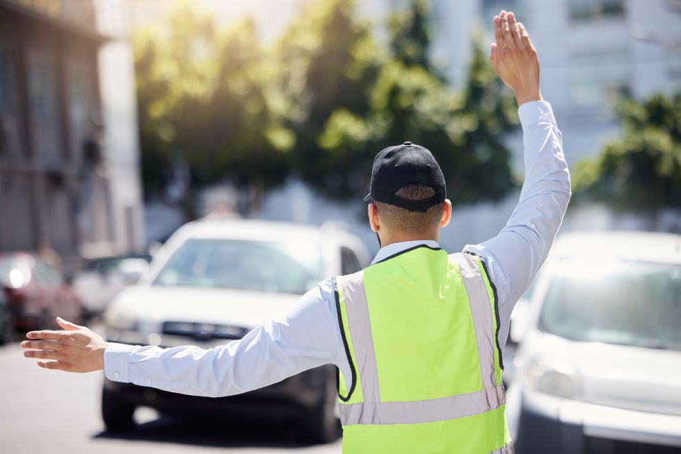 Traffic guard directing traffic